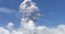 An ash cloud hovers over Mayon volcano, as seen from the Bicol Region, Philippines, in this still image taken from a January 21,2018 social media video. Randall Matthew Lorayes via REUTERS