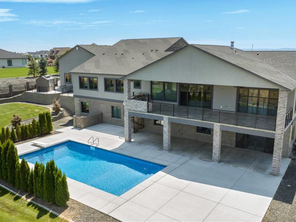 An outdoor swimming pool is among the Pasco home’s numerous amenities.