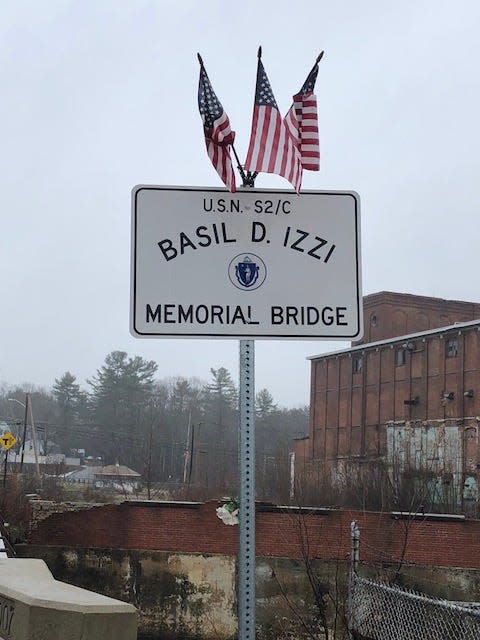 A sign marks the Basil D. Izzi Memorial Bridge in South Barre. It honors the Barre soldier who became a folk hero of World War II after surviving 83 days on a life raft in the Atlantic Ocean.