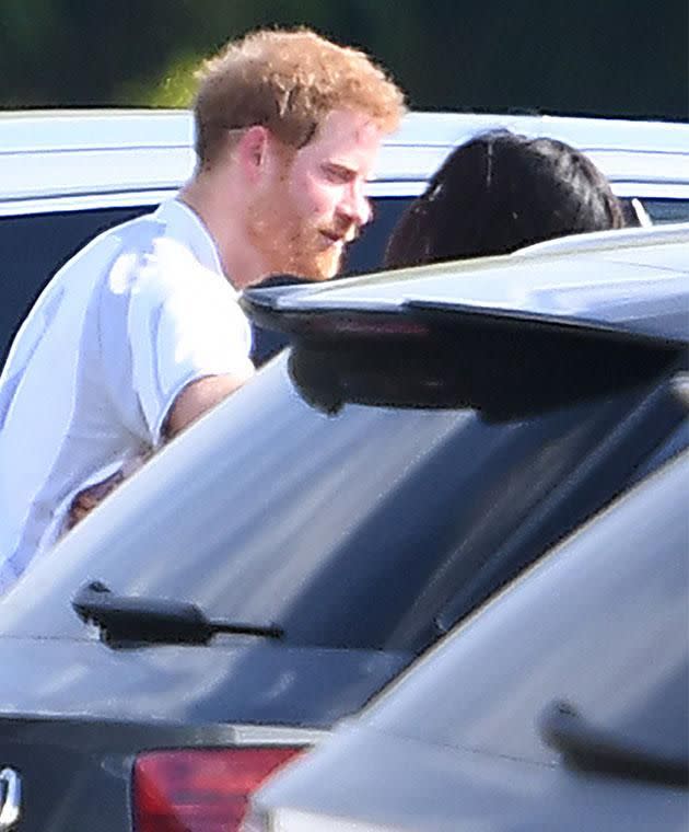 Harry and Meghan were seen sharing a kiss in a carpark after the polo. Photo: Mega Australia