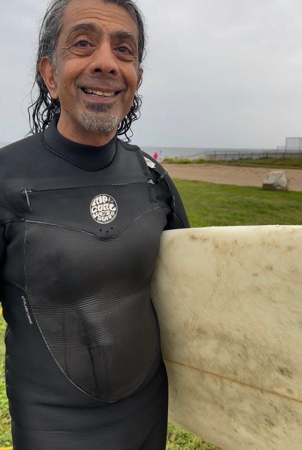 Surfer Jacob Abraham, of Wakefield, spent the early morning riding the swells east of Point Judith with dozens of other wave aficionados catching surf from Lee on Saturday.