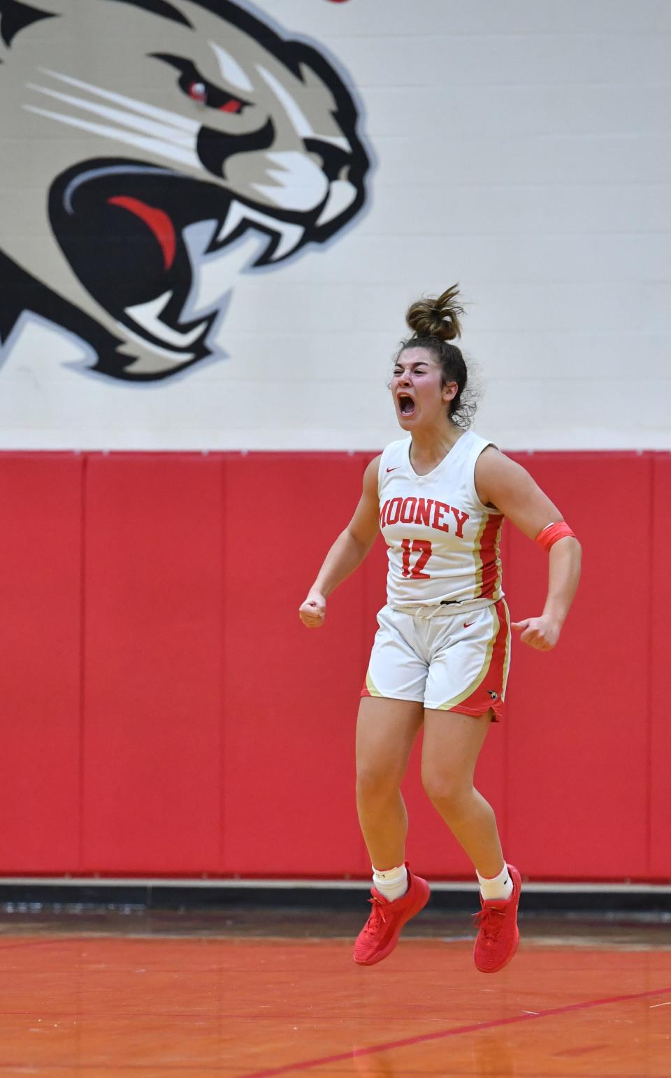 Cardinal Mooney's Olivia Davis shows her emotions after making a three-point shot late in the game. Cardinal Mooney hosted Tampa Catholic in the girls basketball regional semi-final on Tuesday night. 
