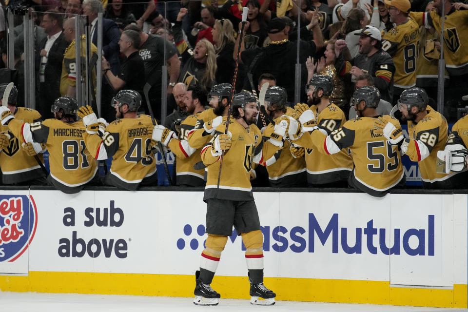 Vegas Golden Knights right wing Mark Stone celebrates his goal with teammates against the Florida Panthers during the third period of Game 1 of the NHL hockey Stanley Cup Finals, Saturday, June 3, 2023, in Las Vegas. (AP Photo/John Locher)