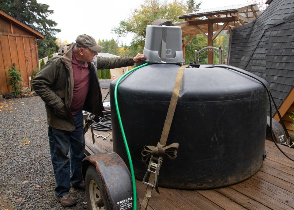 Larry Nelson was forced to buy a 500 gallon water tank after his well went dry due to dropping Lookout Point Reservoir to historically low levels.