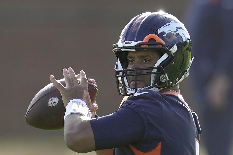 Denver Broncos quarterback Russell Wilson throws the ball during a practice session in Harrow, England, Wednesday, Oct. 26, 2022 ahead the NFL game against Jacksonville Jaguars at the Wembley stadium on Sunday. (AP Photo/Kin Cheung)