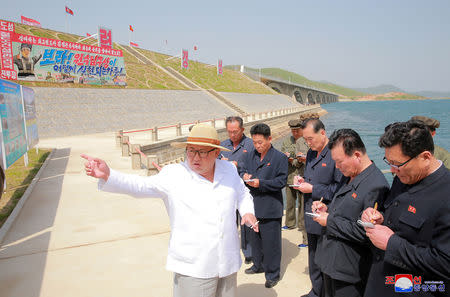 FILE PHOTO: North Korean leader Kim Jong Un inspects the completed railway that connects Koam and Dapchon, in this undated photo released by North Korea's Korean Central News Agency (KCNA) in Pyongyang May 24, 2018. KCNA/via REUTERS/File Photo