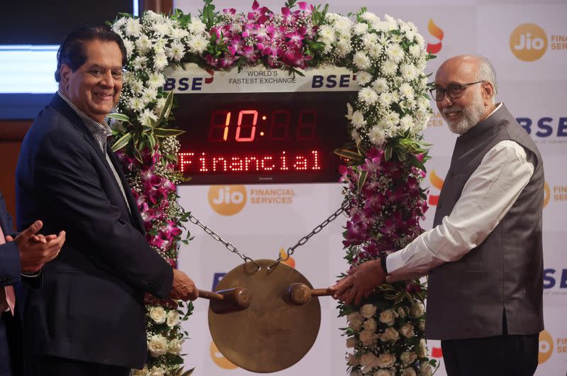 Independent Director and Non Executive Chairman, Jio Financial Services Limited (JFSL), KV Kamath and Chairman Bombay Stock Exchange (BSE), Subhash S Mundra pose for a picture ahead of the listing ceremony of JFSL at the Bombay Stock Exchange in Mumbai
