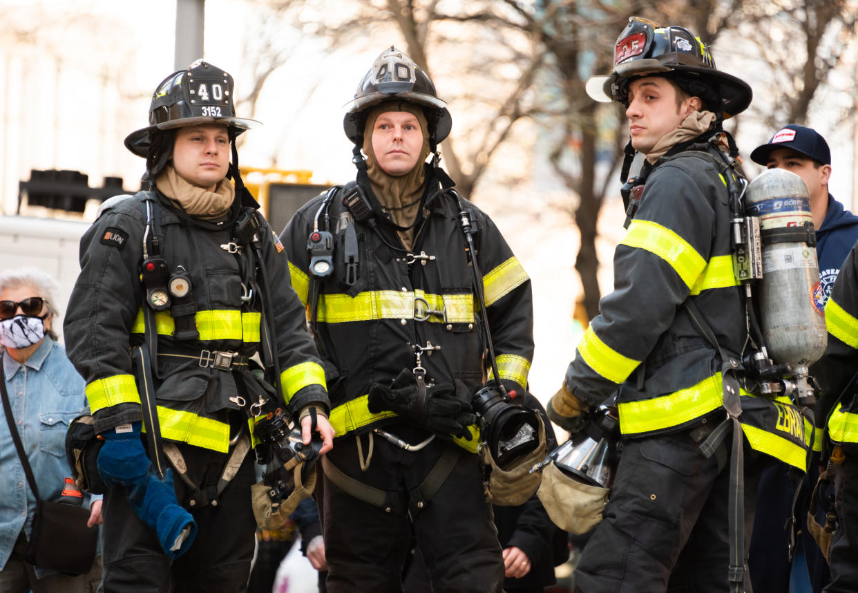 NEW YORK, NEW YORK - MARCH 30: Firefighters stand outside a store on the Upper West Side amid the coronavirus pandemic on March 30, 2021 in New York City. After undergoing various shutdown orders for the past 12 months the city is currently in phase 4 of its reopening plan, allowing for the reopening of low-risk outdoor activities, movie and television productions, indoor dining as well as the opening of movie theaters, all with capacity restrictions. (Photo by Noam Galai/Getty Images)