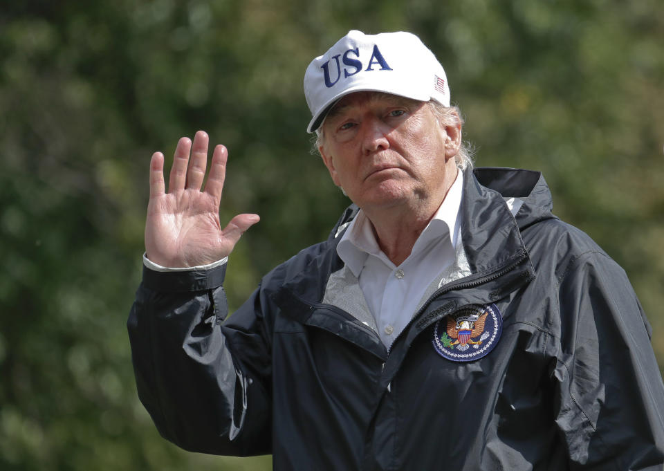 President Donald Trump waves as he arrives at the White House, Thursday, Sept. 14, 2017, in Washington. Trump is returning from Florida after viewing damage from Hurricane Irma. (AP Photo/Alex Brandon)