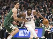 Mar 17, 2019; Milwaukee, WI, USA; Philadelphia 76ers center Joel Embiid (21) drives for the basket against Milwaukee Bucks center Brook Lopez (11) during the fourth quarter at Fiserv Forum. Mandatory Credit: Jeff Hanisch-USA TODAY Sports