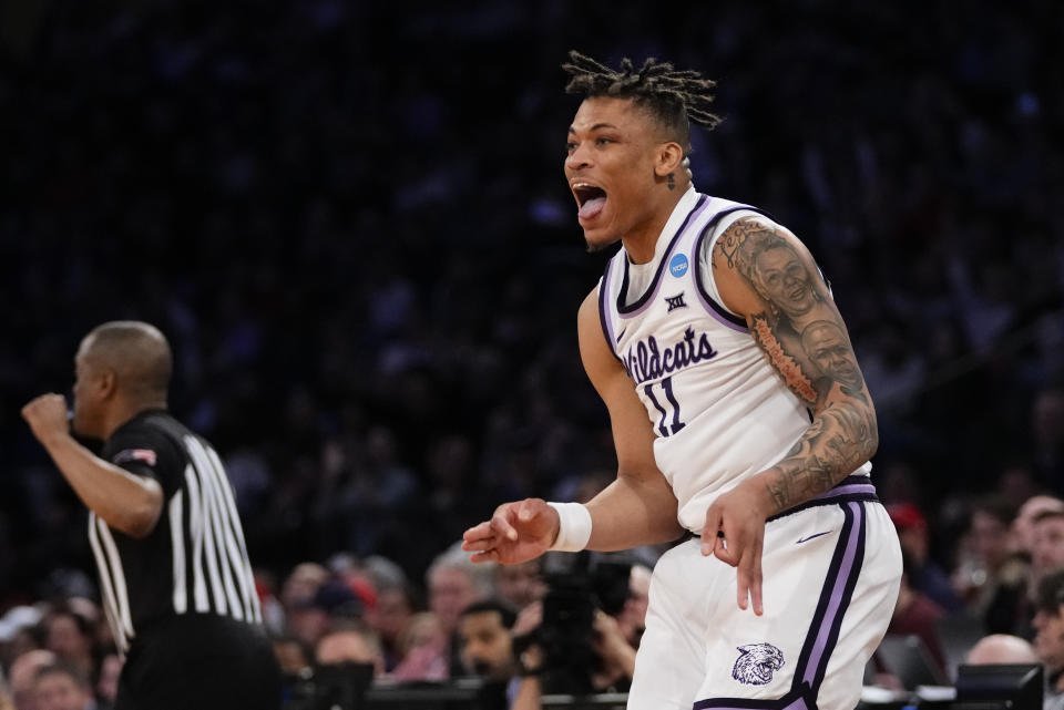 Kansas State's Keyontae Johnson (11) reacts after shooting a three-point basket in the second half of an Elite 8 college basketball game against Florida Atlantic in the NCAA Tournament's East Region final, Saturday, March 25, 2023, in New York. (AP Photo/Frank Franklin II)