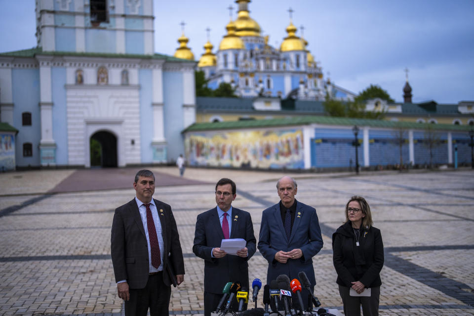 From left, U.S. representatives Nathaniel Moran, R-Tx, Tom Kean Jr, R-NJ, Bill Keating, D-Mass, and Madeleine Deane, D-Pa, talk to journalists during a joint news conference outside Saint Michael cathedral in Kyiv, Ukraine, Monday, April 22, 2024. A bipartisan delegation of U.S. Congress members met President Volodymyr Zelenskyy in Kyiv on Monday and praised the historic House vote to approve $61 billion in military aid for Ukraine. (AP Photo/Francisco Seco)