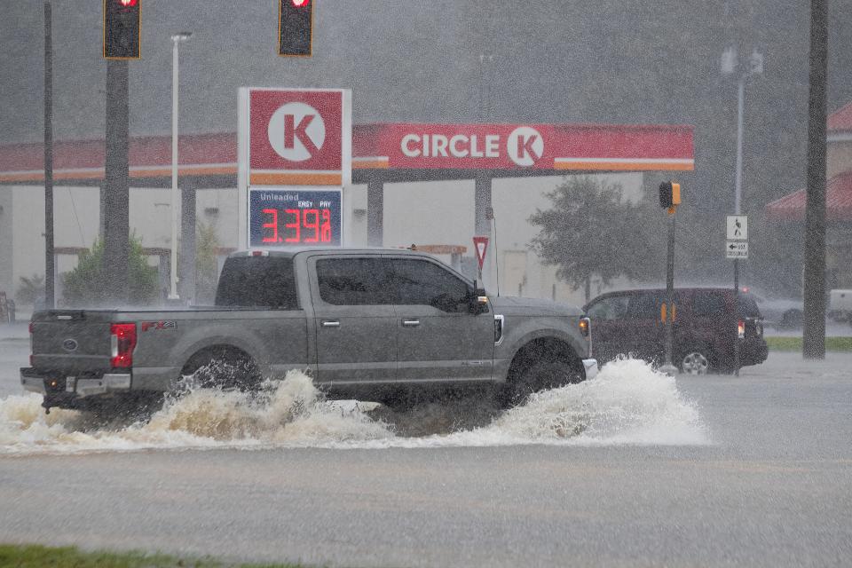 Drivers continued through the intersection despite the flood waters that had submerged Hwy 301 at Veterans Memorial Pkwy in Statesboro, GA on Wednesday Aug 30th 2023.