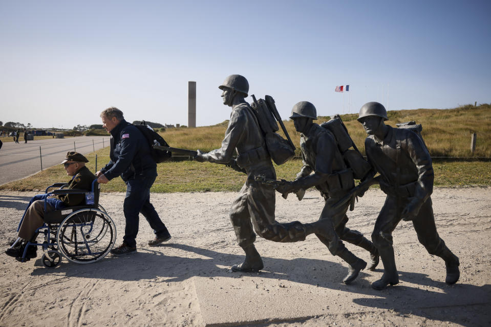 An American veteran is wheeled away after a commemoration organized by the Best Defense Foundation at Utah Beach near Sainte-Marie-du-Mont, Normandy, France, Sunday, June 4, 2023, ahead of the D-Day Anniversary. The landings on the coast of Normandy 79 year ago by U.S. and British troops took place on June 6, 1944. (AP Photo/Thomas Padilla)