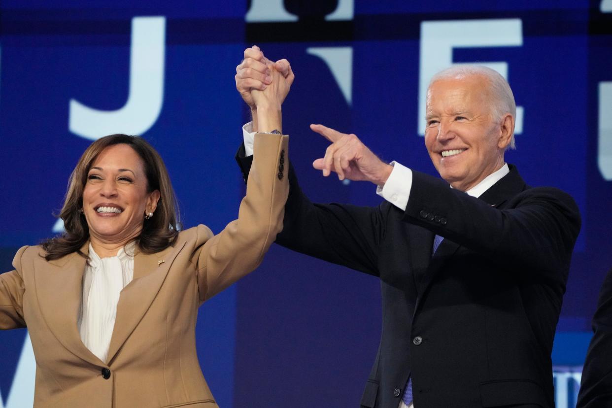 President Joe Biden speaks and Vice President Kamala Harris during the first day of the Democratic National Convention at the United Center.