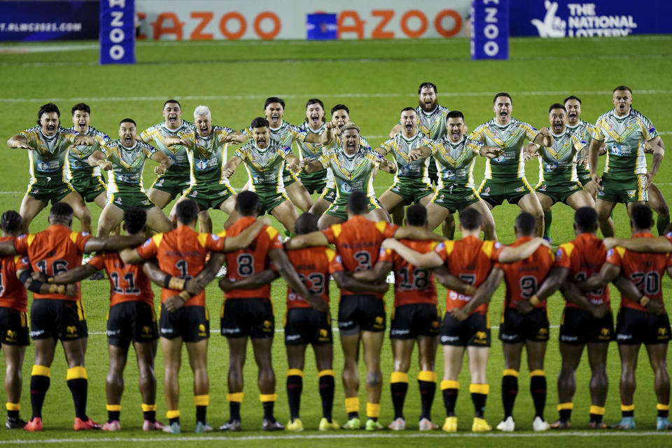 Cook Islands players perform the Maori Ura ahead of the Rugby League World Cup group D match between Papua New Guinea and Cook Islands at The Halliwell Jones Stadium, Warrington, England, Tuesday Oct. 25, 2022. (Mike Egerton/PA via AP)