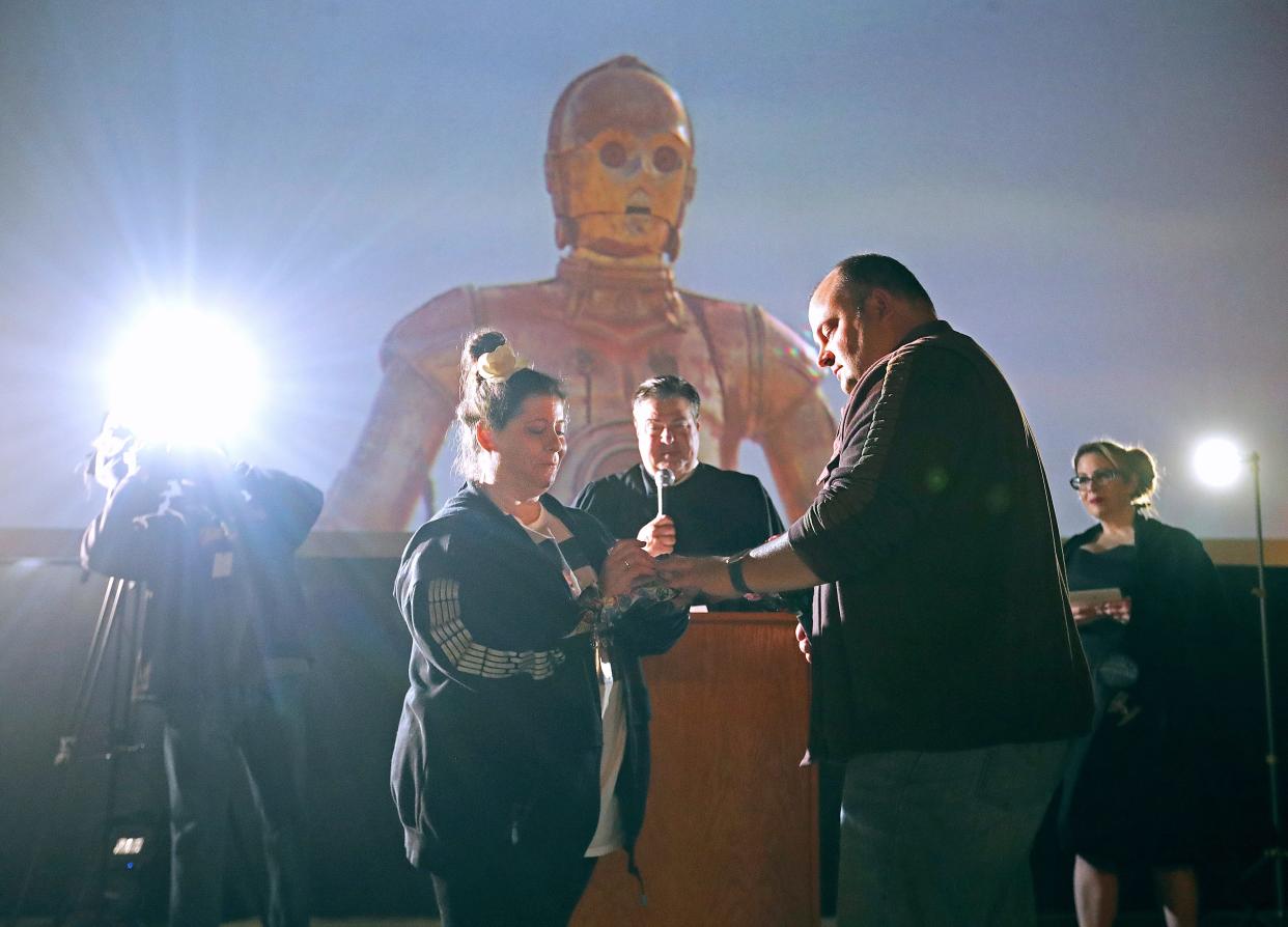 Akron Municipal Court Judge Ron Cable presides over a Star Wars themed wedding for Julie Samuels and Jared Bernstein of Beachwood on Wednesday at the Highland Theater in Akron.