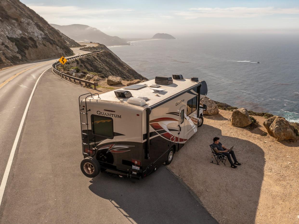 A mockup of a Thor RV by the ocean with Starlink.