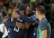 2016 Rio Olympics - Basketball - Final - Men's Gold Medal Game Serbia v USA - Carioca Arena 1 - Rio de Janeiro, Brazil - 21/8/2016. Carmelo Anthony (USA) of the USA is hugged by Kevin Durant (USA) of the USA. REUTERS/Jim Young