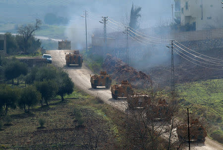 Turkish military armoured vehicles arrive at a border village near the town of Hassa in Hatay province, Turkey. Baris Kadirhan/Depo Photos via REUTERS