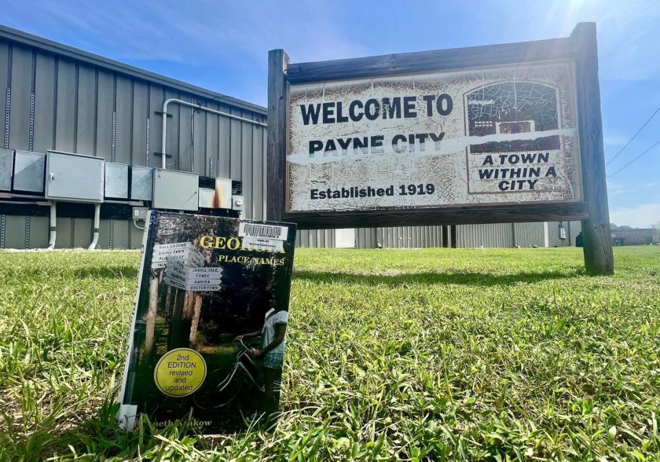 A copy of Kenneth Krakow’s “Georgia Place-Names,” first published in the 1970s, propped for this photo near a Payne City sign in Macon. According to the book, “William Sims Payne started Payne Mill and it was chartered February 25, 1876. The mill was sold to Bibb Manufacturing Co. in 1905.”