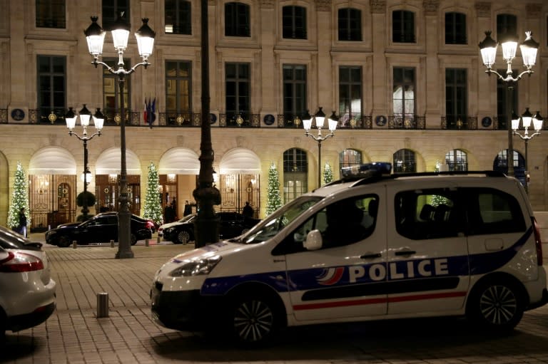 Five men armed with handguns and hatchets smashed the display windows of jewellery shops in the Ritz hotel on the luxurious Place Vendome in Paris