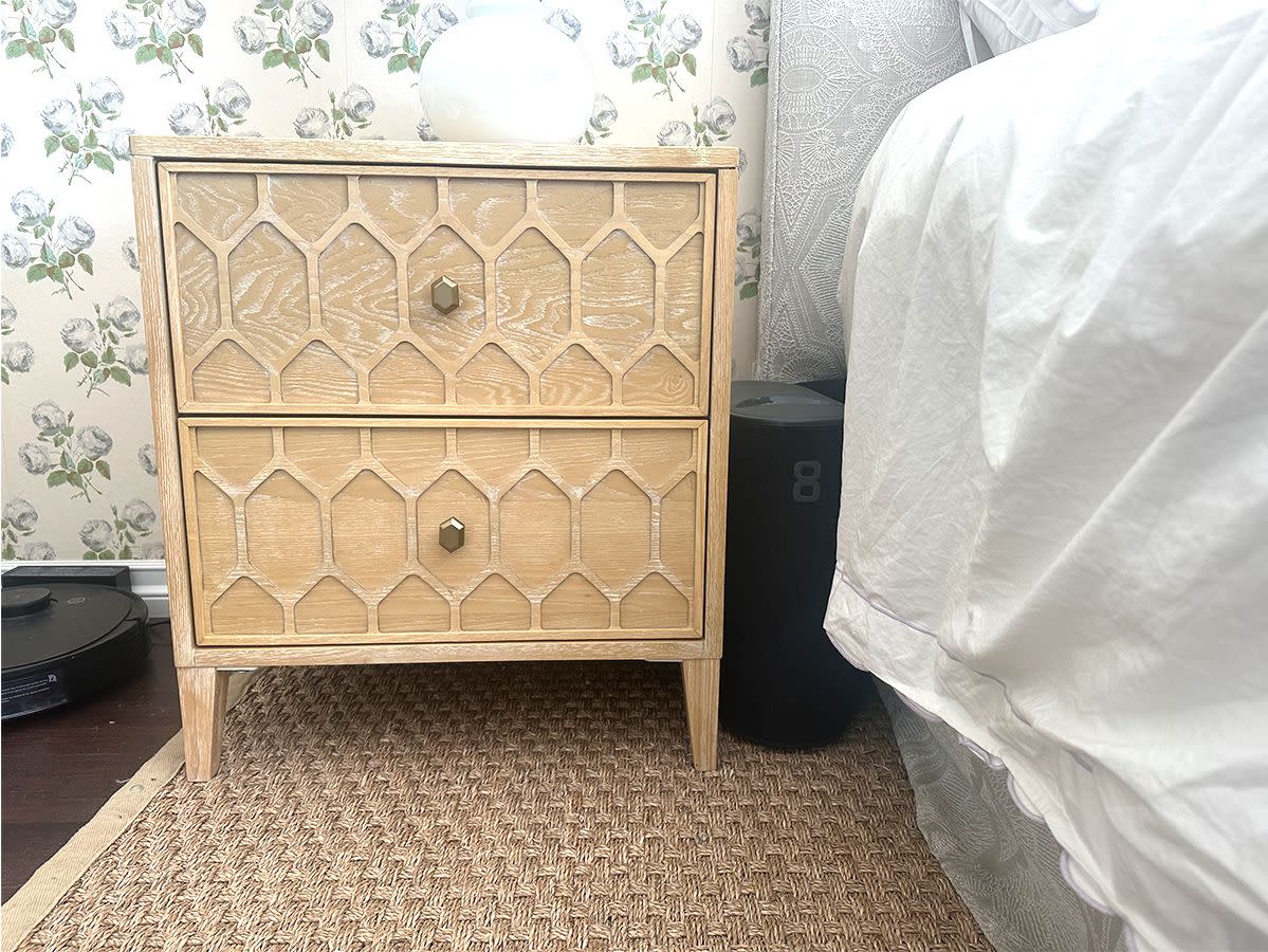 eight sleep pod hub on floor between nightstand and bed