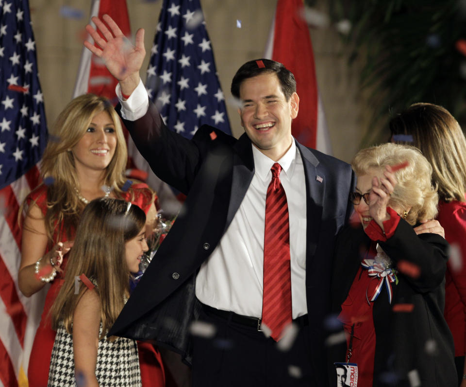 FILE-In this Nov. 2, 2010, file photo, Republican Senator-elect Marco Rubio hugs his mother Oria after thanking supporters in Coral Gables, Fla. To the left is his wife Jeanette and daughter Amanda. Rubio is a tea party favorite and is often talked about as a potential 2016 presidential candidate. (AP Photo/Alan Diaz, File)