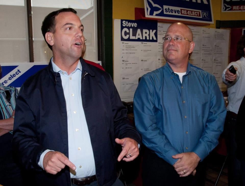 Ontario Progressive Conservative Leader Tim Hudak talks to supporters as Leeds-Grenville MPP Steve Clark looks on  in Brockville, Ontario on September 7, 2011. Ontarians will vote in a provincial election on Oct.6. 