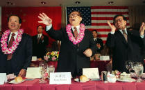 FILE - Chinese then President Jiang Zemin, center, waves as Chinese then Vice President Qian Quichen, left, and Zeng Qinghong, then special assistant to the president, look on at a dinner hosted by the Southern California Chinese American Community in Los Angeles, Nov. 2, 1997. Chinese state TV said Wednesday, Nov. 30, 2022, that Jiang has died at age 96. (Hector Mata/Pool Photo via AP, File)