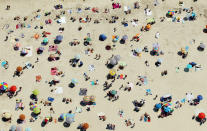An aerial view of New Yorkers cooling off at Jones Beach on August 4, 2012 in Wantagh, New York. The past year through June 2012 in the continental Unite States has been the hottest since modern record-keeping started in 1895, according to the National Oceanic and Atmospheric Administration (NOAA). NOAA also reports the ten warmest years since 1895 have occurred since 2000. A weather expert at the agency suggested climate change has a role in the high temperatures. (Photo by Mario Tama/Getty Images)