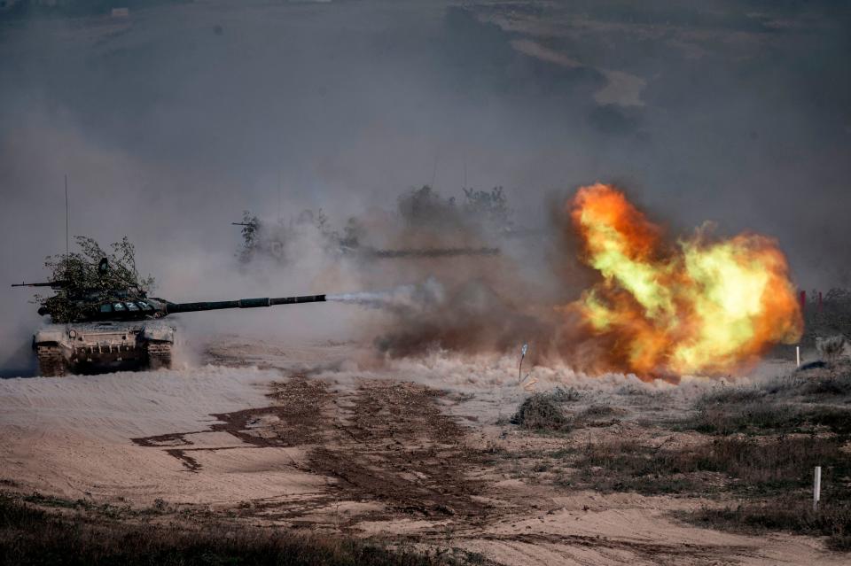 A Russian army T-72-B3 tank fires during military exercises at the Raevsky range in Southern Russia on September 23, 2020 during the "Caucasus-2020" military drills gathering China, Iran, Pakistan and Myanmar troops, along with ex-Soviet Armenia, Azerbaijan and Belarus.