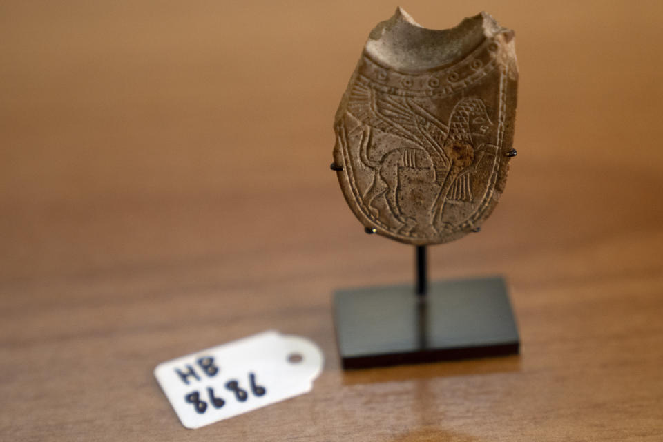 A 2,700-year-old ivory incense spoon plundered from a site in the occupied West Bank — seized in late 2021 by the Manhattan District Attorney's office as part of a plea deal with billionaire hedge fund manager Michael Steinhardt, displayed at the Palestinian Ministry of Tourism and Antiquities in the West Bank city of Bethlehem, Thursday, Jan. 19, 2023. Earlier this month, American officials handed over the artifact to the Palestinians in what the U.S. State Department's Office of Palestinian Affairs said was "the first event event of such repatriation" by the U.S. to the Palestinians. (AP Photo/ Maya Alleruzzo)