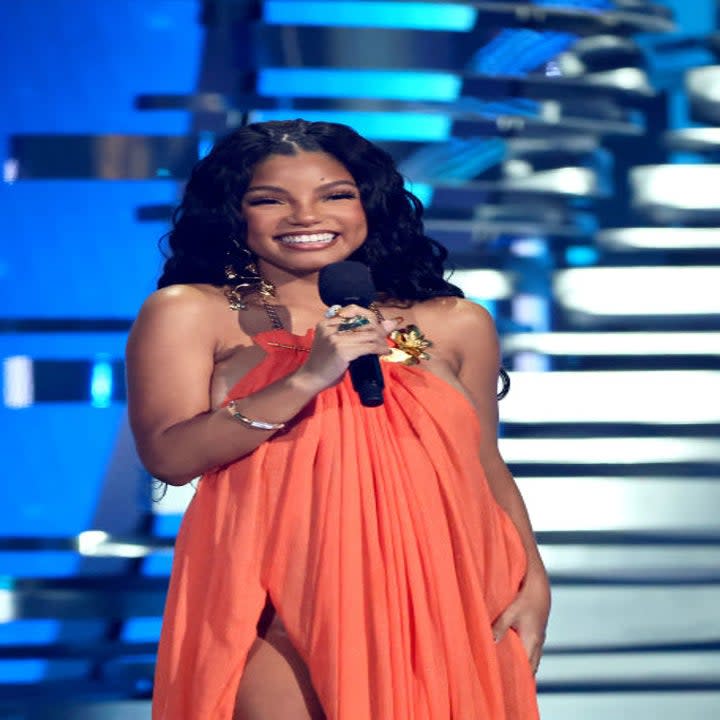 Halle onstage smiling at the VMAs