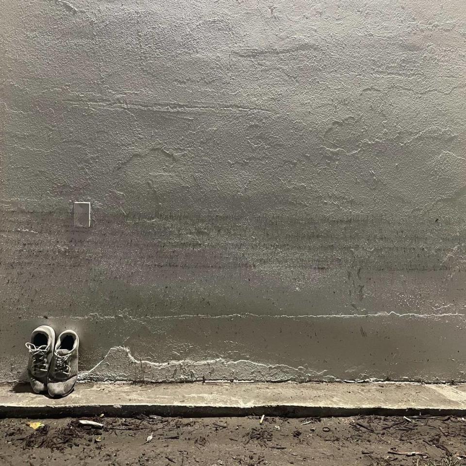 A pair of shoes were left to dry against a wall and under flood water marks at the Stillwater Cove apartments in Naples’ River Park neighborhood on Saturday, Oct. 1, 2022. Hurricane Ian’s storm surge caused many first-floor units to flood on Wednesday, Sept. 28.