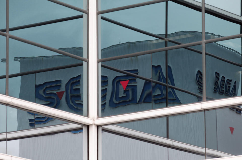 Sega Corp. logos are reflected in windows near the company headquarters in Tokyo June 20, 2011. Japanese video game developer Sega Corp said on Sunday that information belonging to 1.3 million customers has been stolen from its database, the latest in a rash of global cyber attacks against video game companies. REUTERS/Kim Kyung-Hoon (JAPAN - Tags: CRIME LAW SCI TECH BUSINESS) - GM1E76K19QU01