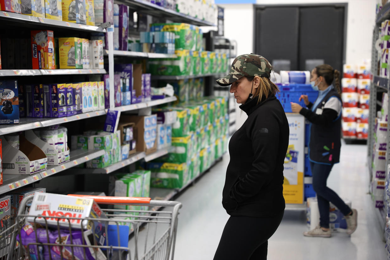 A woman without a face mask in a New Jersey store. The WHO and the L.A. County Department of Health are recommending people mask up inside. (Tayfun Coskun/Anadolu Agency via Getty Images)