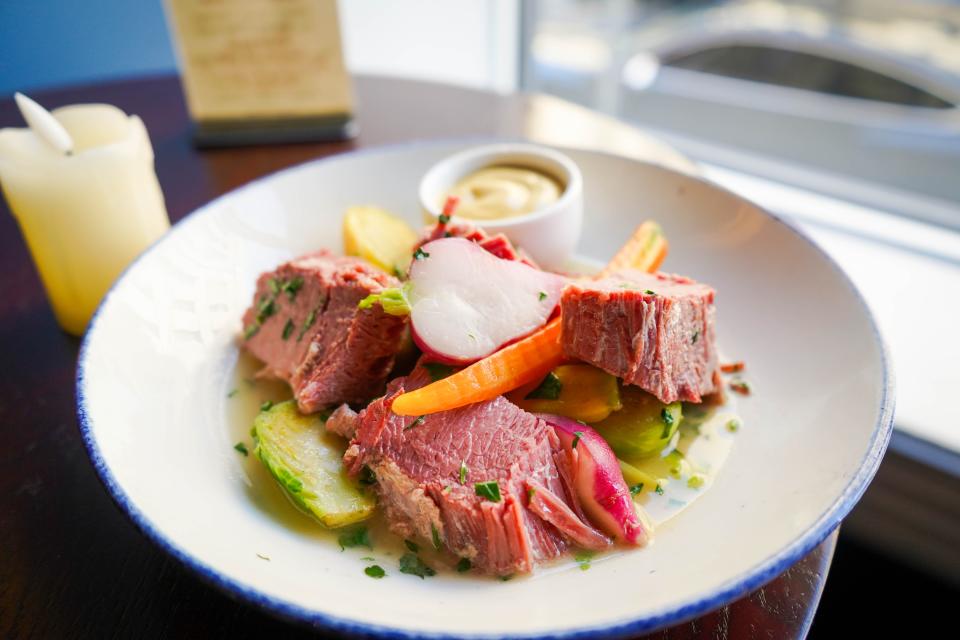 House-corned beef short rib with buttered baby spring vegetables, Yukon potatoes and herb broth at The Black Swan in Asbury Park.