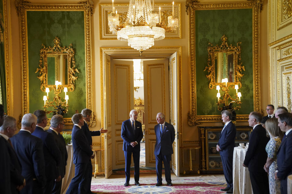 US Special Presidential Envoy for Climate John Kerry, sixth left, speaks to U.S. President Joe Biden, centre left and Britain's King Charles III during a climate engagement with philanthropists and investors at Windsor Castle, in Windsor, England, Monday, July 10, 2023. Kevin Lamarque/Pool Photo via AP)