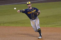 FILE - In this Sept. 30, 2020, file photo, Milwaukee Brewers third baseman Eric Sogard throws to first base during Game 1 of a National League wild-card baseball series in Los Angeles. The Brewers have declined 2021 options on infielders Jedd Gyorko and Eric Sogard as well as outfielder Ben Gamel. (AP Photo/Ashley Landis, File)