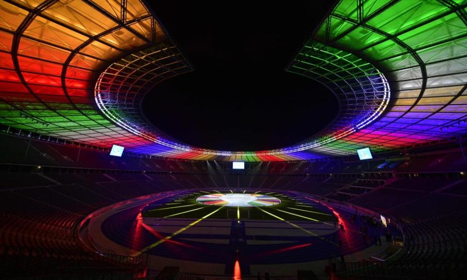 The Olympiastadion in Berlin, venue for the Euro 2024 final, lit up with the colours of the championship logo