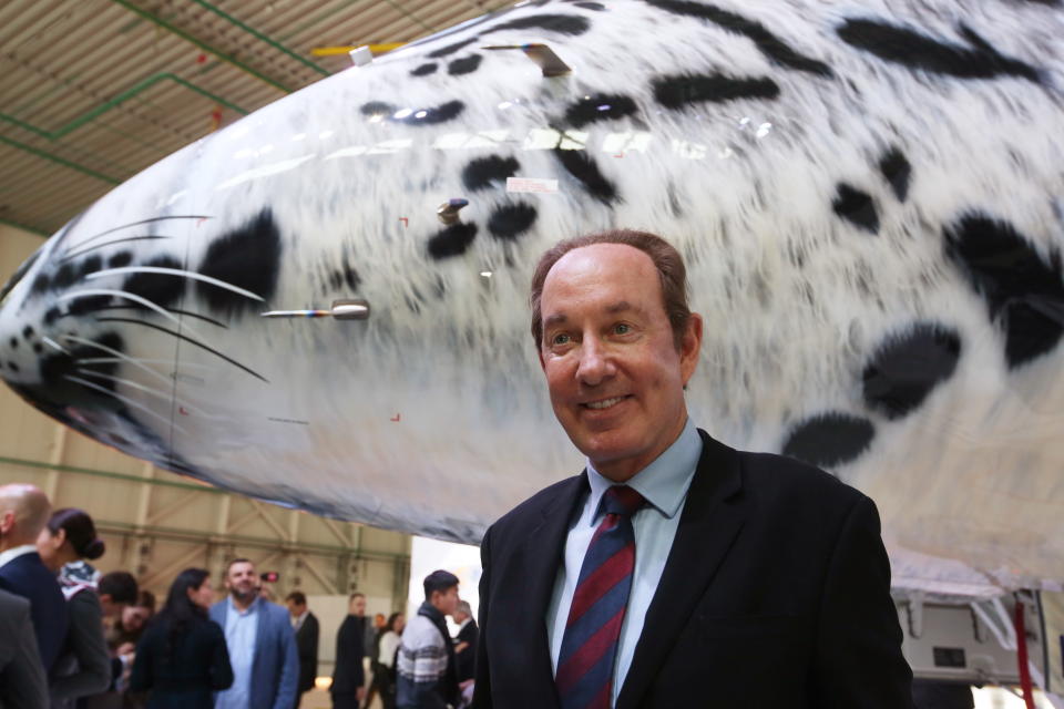 Air Astana President Peter Foster shows off the new Embraer 190-E2 plane with a snow leopard’s snout painted on the jet’s nose at Astana International Airport. (Photo: Marina Lystseva/TASS via Getty Images)