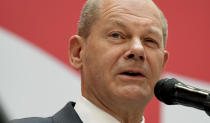 Olaf Scholz, top candidate for chancellor of the Social Democratic Party (SPD), speaks during a press conference at the party's headquarters in Berlin, Germany, Monday, Sept. 27, 2021. The center-left Social Democrats have won the biggest share of the vote in Germany's national election. They narrowly beat outgoing Chancellor Angela Merkel's center-right Union bloc in a closely fought race that will determine who succeeds the long-time leader at the helm of Europe's biggest economy. (AP Photo/Michael Sohn)