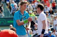 Mar 31, 2015; Key Biscayne, FL, USA; Andy Murray (R) shakes hands with Kevin Anderson (L) on day nine of the Miami Open at Crandon Park Tennis Center. Murray won 6-4, 3-6, 6-3. Mandatory Credit: Geoff Burke-USA TODAY