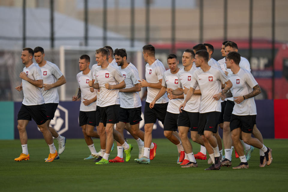 Poland players work out during a training session in Doha, Qatar, Saturday, Dec. 3, 2022. Poland will play against France in the round of 16 phase of the World Cup soccer tournament on Dec. 4. (AP Photo/Julio Cortez)