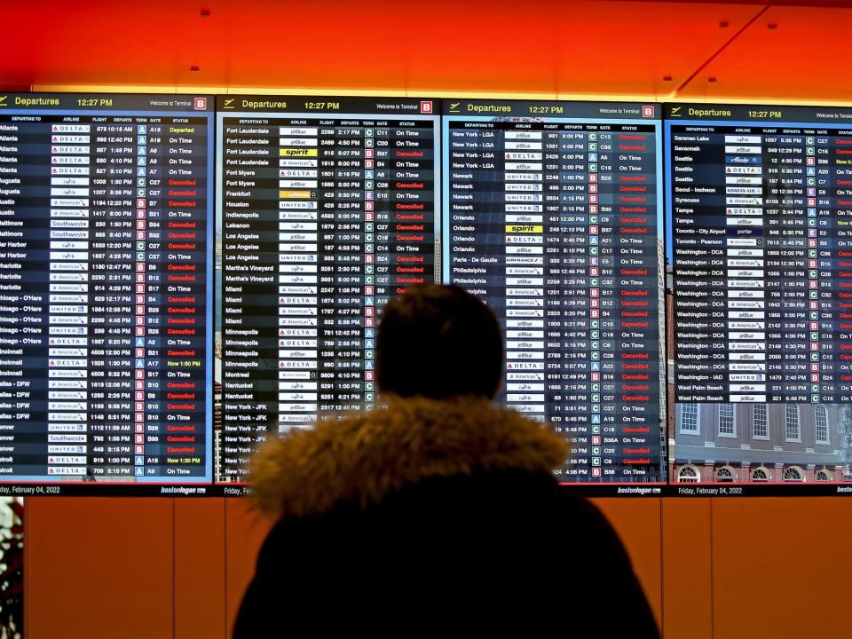 Canceled flights, plane de-icing and runway clearing at Logan Int. Airport on February 4, 2022 in BOSTON, Massachusetts.