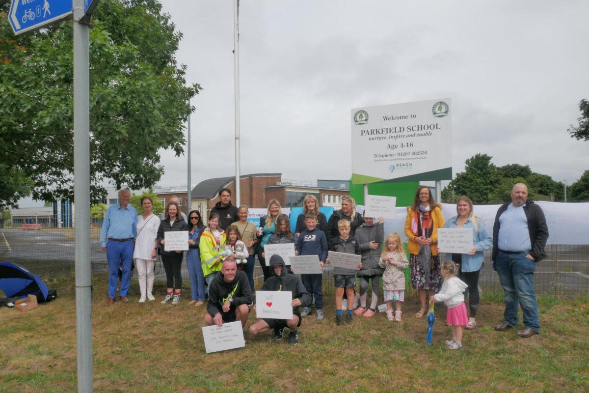 Parents and children gathered outside Parkfield School to protest. <i>(Image: Daily Echo)</i>