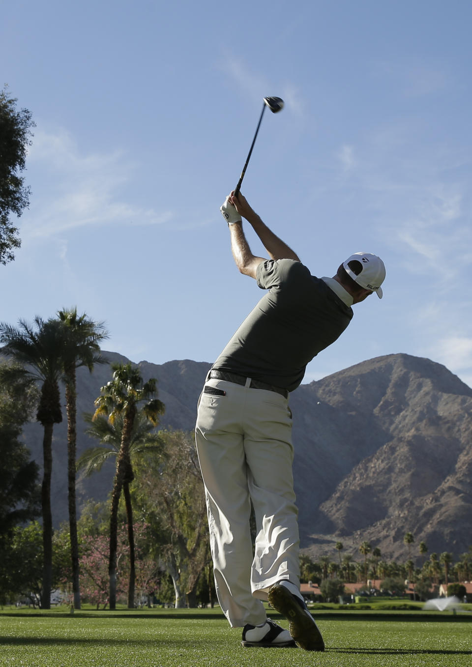 Brendon Todd watches his tee shot on the ninth hole during the third round of the Humana Challenge golf tournament at La Quinta Country Club on Saturday, Jan. 18, 2014 in La Quinta, Calif. (AP Photo/Chris Carlson)