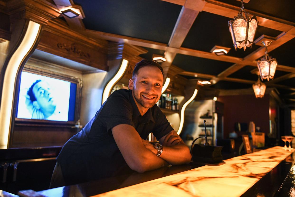 Mitch Pachta, owner of Vacancy and its sister bar Cashmere Cricket, poses for a portrait in the speakeasy situated in the Vacancy's basement in Cuyahoga Falls July 5.