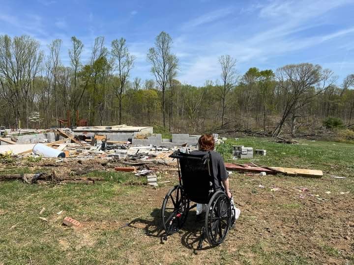 Felene Taylor visiting the site of her former home in a wheelchair during her recovery from injuries sustained during a March 31, 2023 tornado.